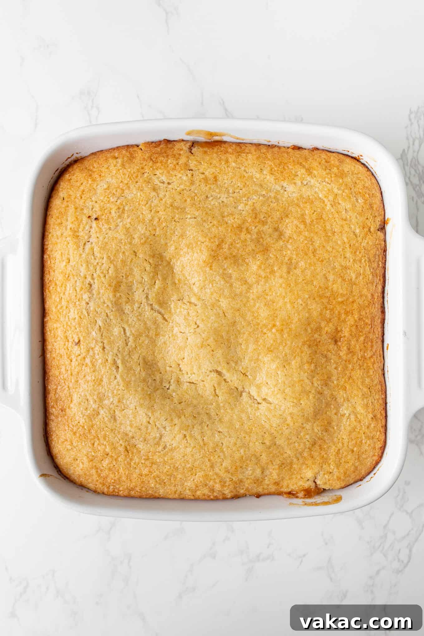 Classic Apple Cobbler with Cinnamon Crumble 7 An overhead view of apple cobbler in a baking dish.