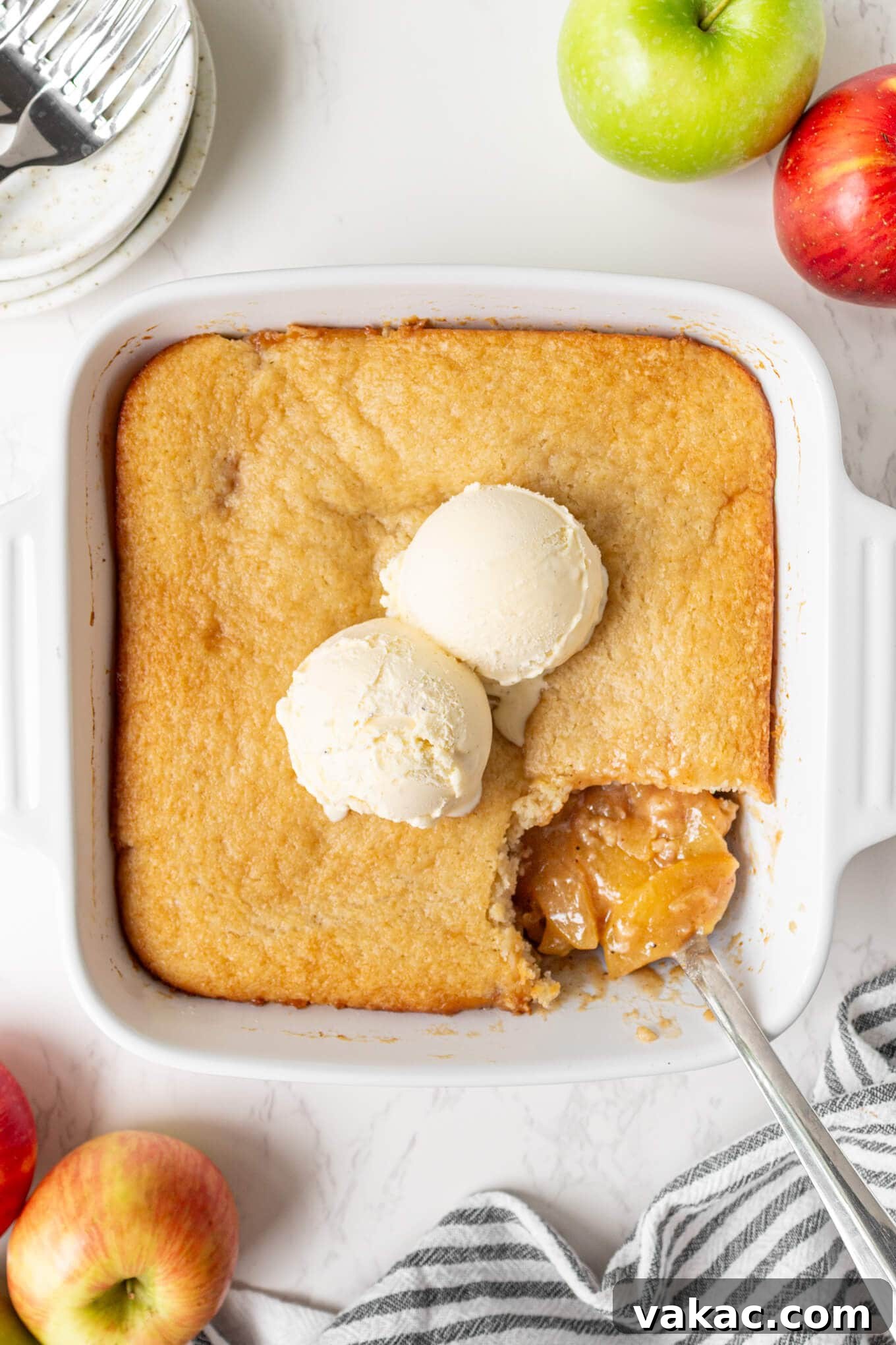 Classic Apple Cobbler with Cinnamon Crumble 8 An overhead view of apple cobbler topped with two scoops of ice cream.