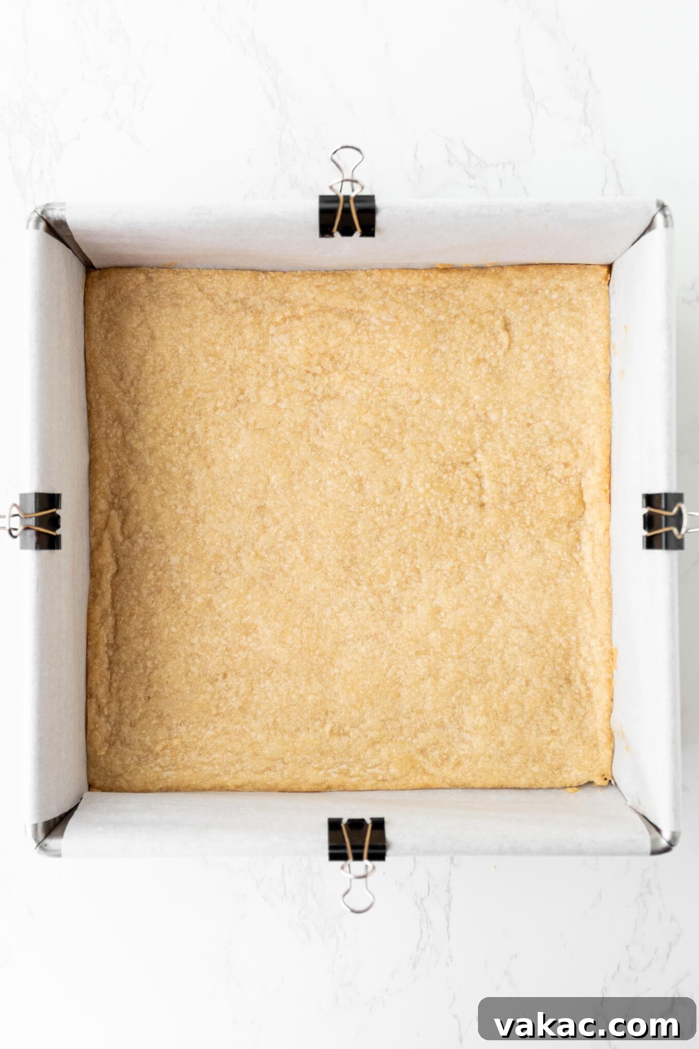 Caramel Apple Cheesecake Bars with Cinnamon Crust 4 An overhead view of a shortbread crust after par-baking.