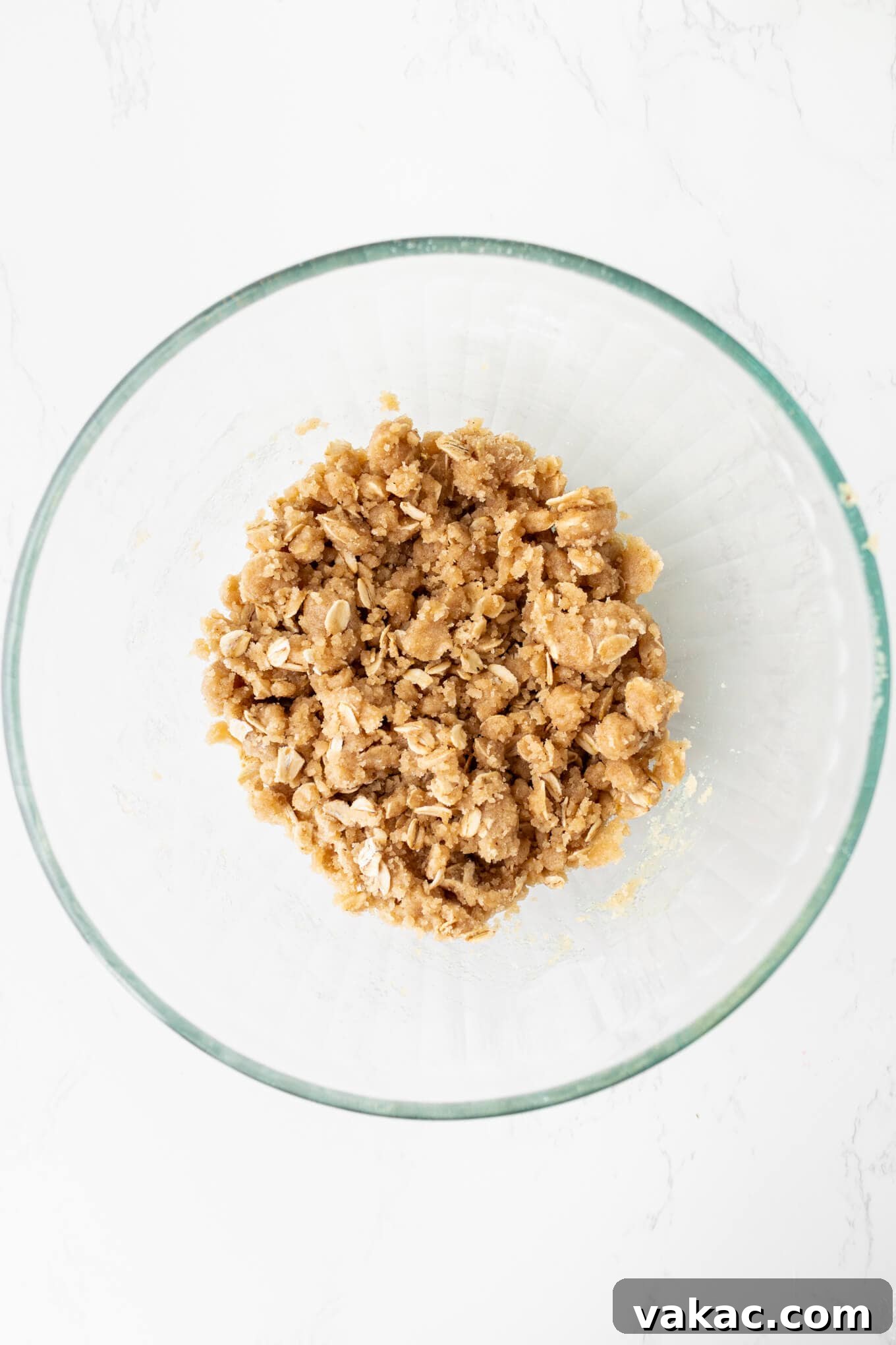 Caramel Apple Cheesecake Bars with Cinnamon Crust 5 An overhead view of streusel in a mixing bowl.